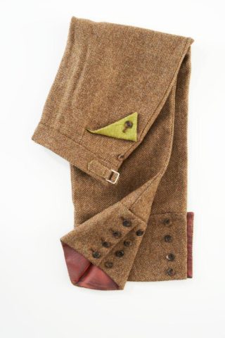 Ladies brown trousers by LUCAN Fashion in brown herringbone with chartreuse as a pop colour. 3/4 length and lined inside. The product SKU is LF007B.